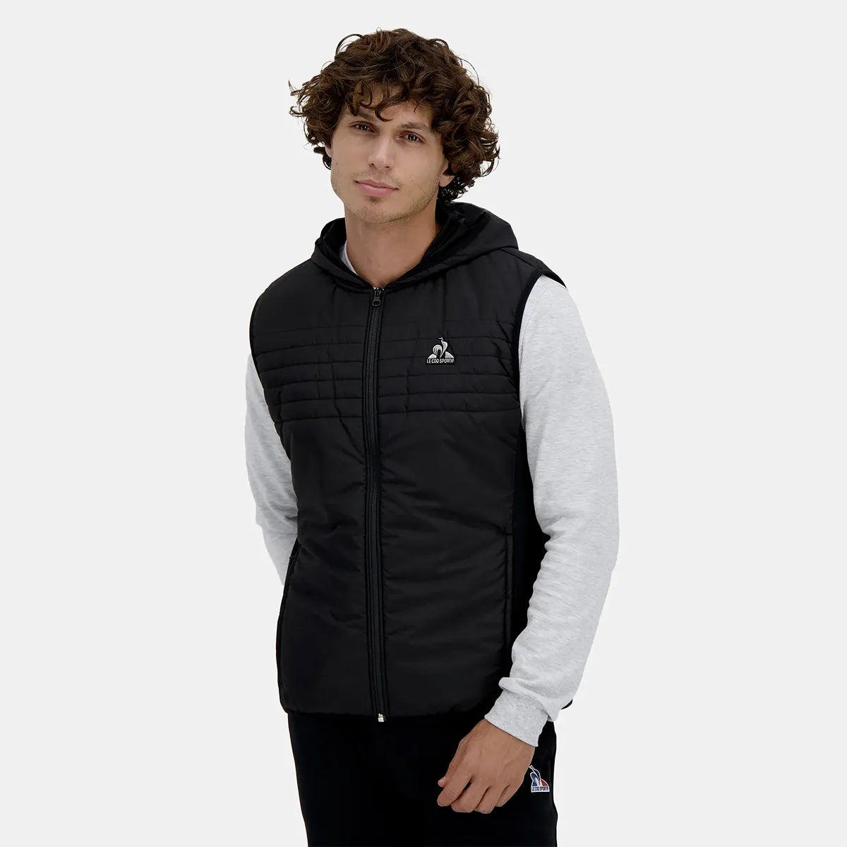 DOUDOUNE LE COQ SPORTIF HYBRIDE SANS MANCHES CAPUCHE